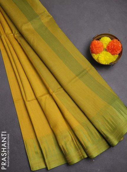 Semi dupion saree mustard yellow and light green with allover thread stripe pattern and temple design thread woven border