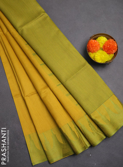 Semi dupion saree mustard yellow and light green with allover thread stripe pattern and temple design thread woven border