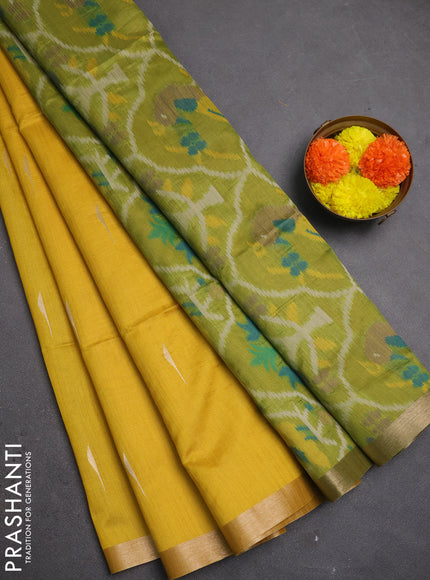 Semi dupion saree mustard yellow and light green with allover zari woven buttas and zari woven border