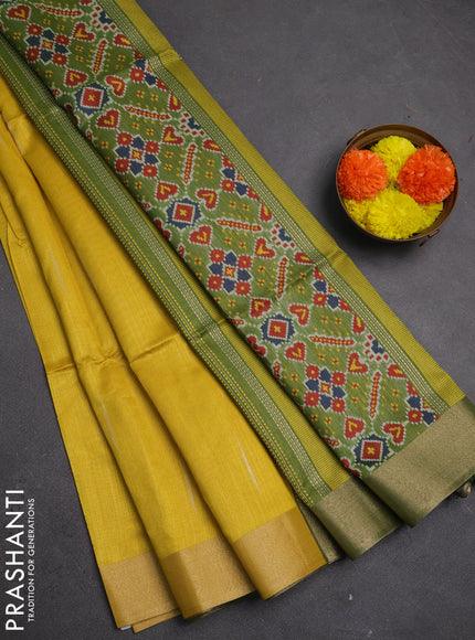 Semi dupion saree mustard yellow and light green with allover zari woven buttas and zari woven border