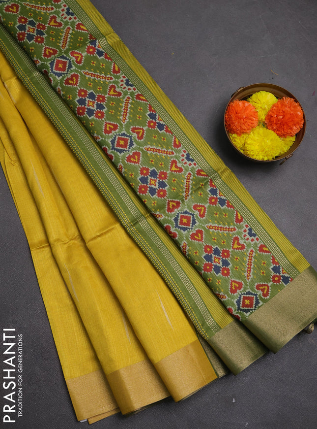 Semi dupion saree mustard yellow and light green with allover zari woven buttas and zari woven border