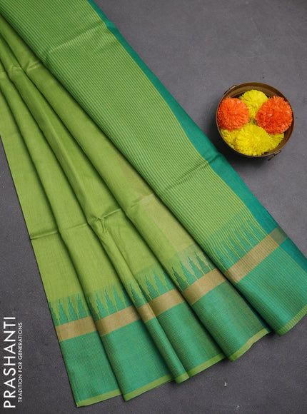 Semi dupion saree light green and teal green with plain body and temple design woven border