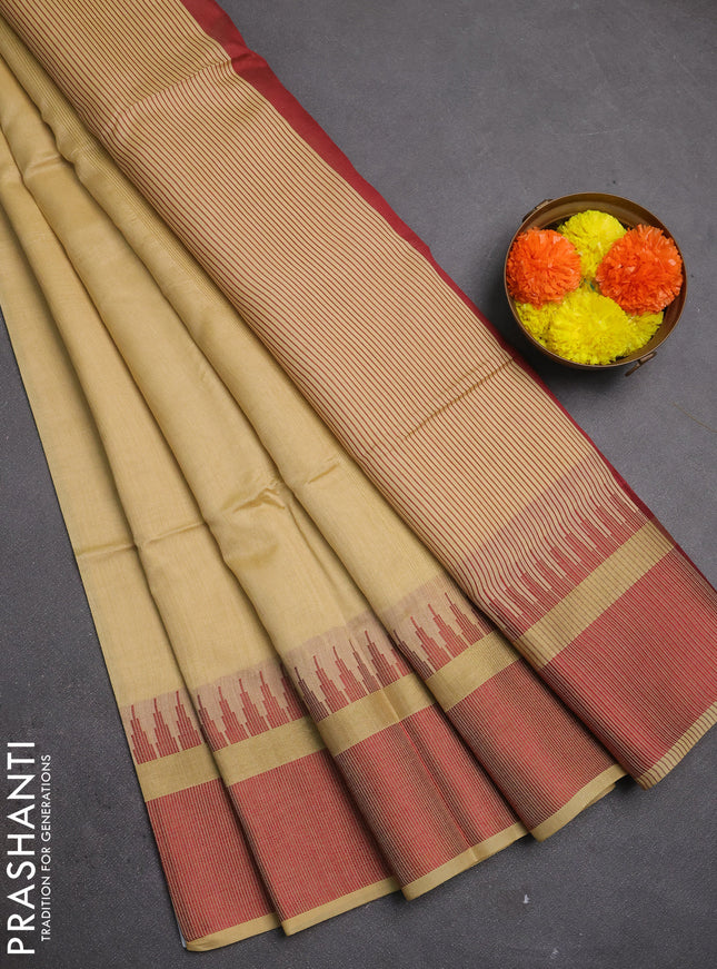 Semi dupion saree beige and maroon with plain body and temple design woven border