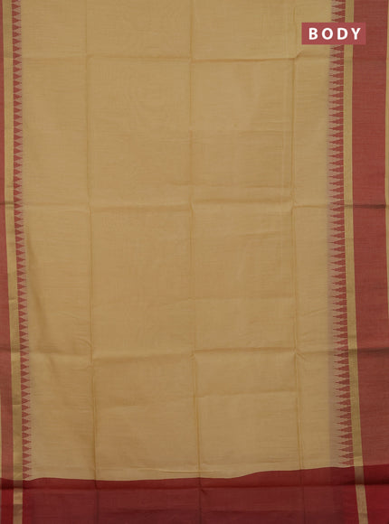 Semi dupion saree beige and maroon with plain body and temple design woven border