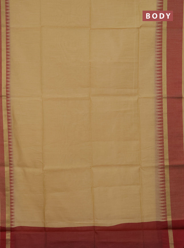 Semi dupion saree beige and maroon with plain body and temple design woven border