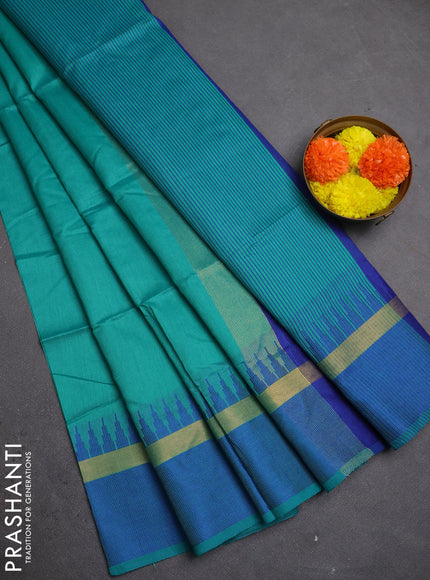 Semi dupion saree teal green and blue with plain body and temple design woven border
