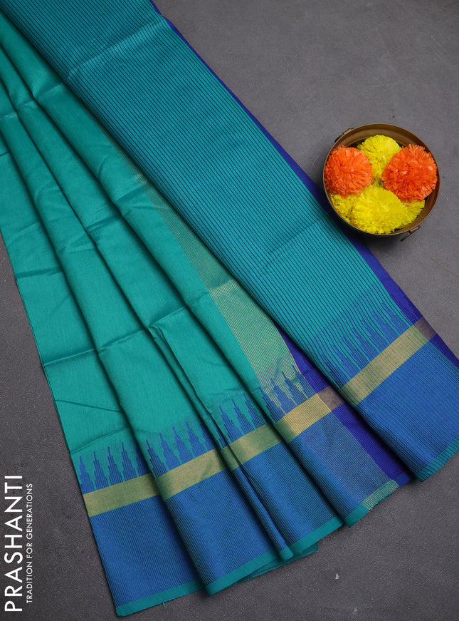 Semi dupion saree teal green and blue with plain body and temple design woven border