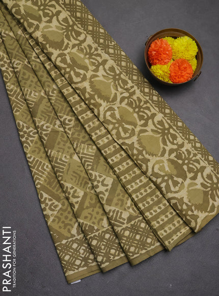 Jaipur cotton saree elaichi green with allover dabu prints and printed border
