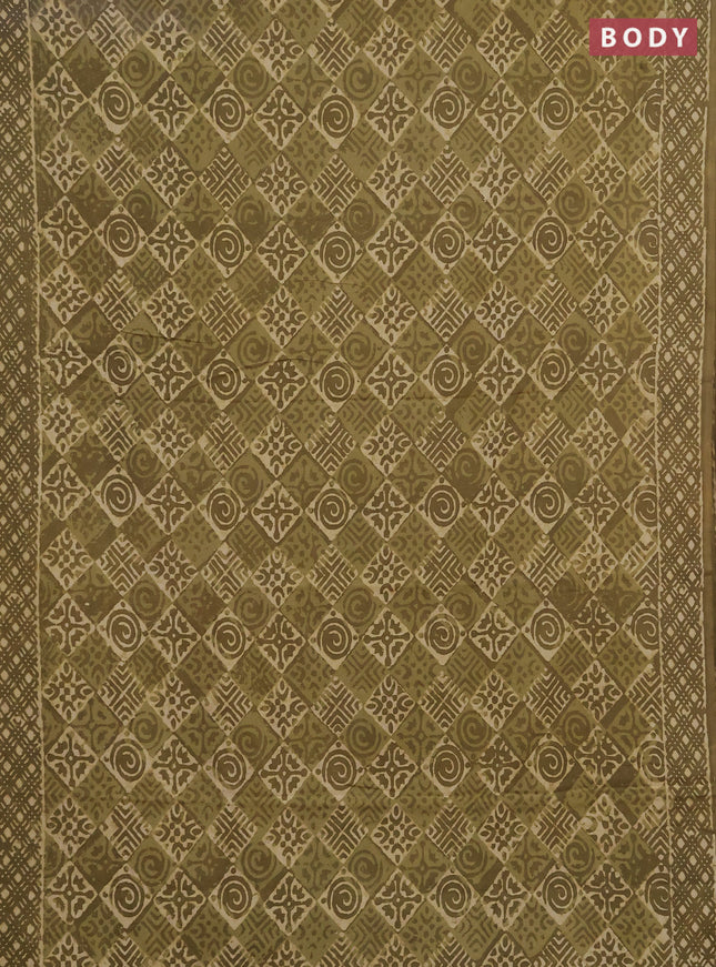 Jaipur cotton saree elaichi green with allover dabu prints and printed border