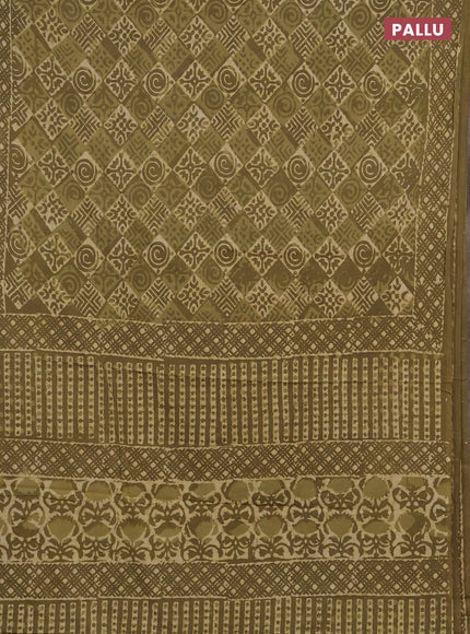 Jaipur cotton saree elaichi green with allover dabu prints and printed border