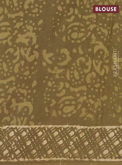 Jaipur cotton saree elaichi green with allover dabu prints and printed border