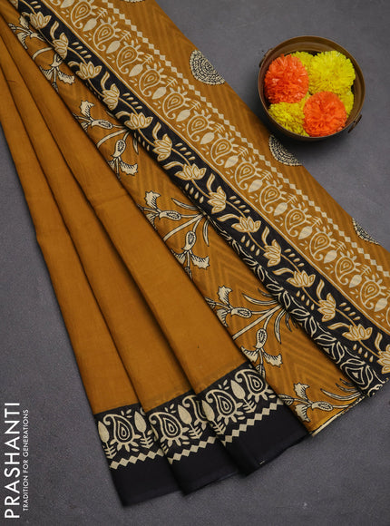 Jaipur cotton saree dark mustard and black with plain body and printed border