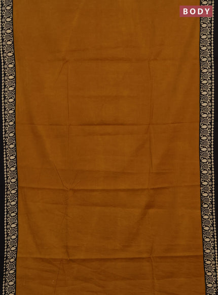 Jaipur cotton saree dark mustard and black with plain body and printed border