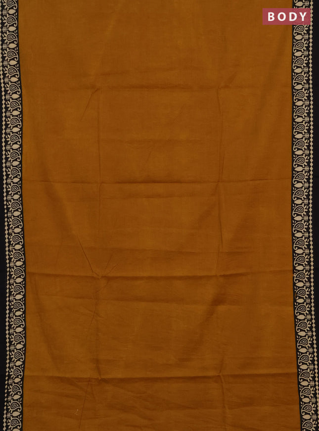 Jaipur cotton saree dark mustard and black with plain body and printed border