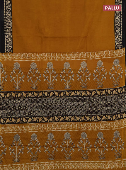 Jaipur cotton saree dark mustard and black with plain body and printed border