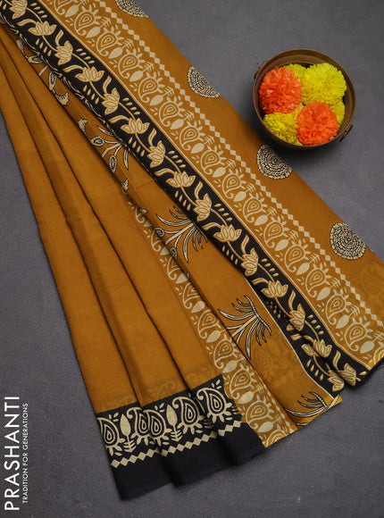 Jaipur cotton saree dark mustard and black with plain body and printed border