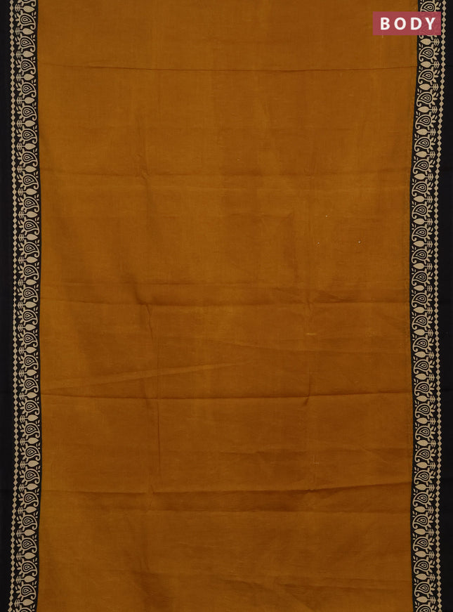Jaipur cotton saree dark mustard and black with plain body and printed border