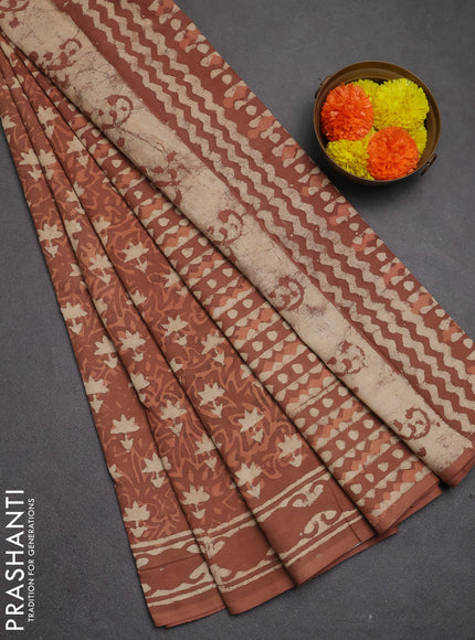 Jaipur cotton saree dark peach with allover dabu prints and printed border