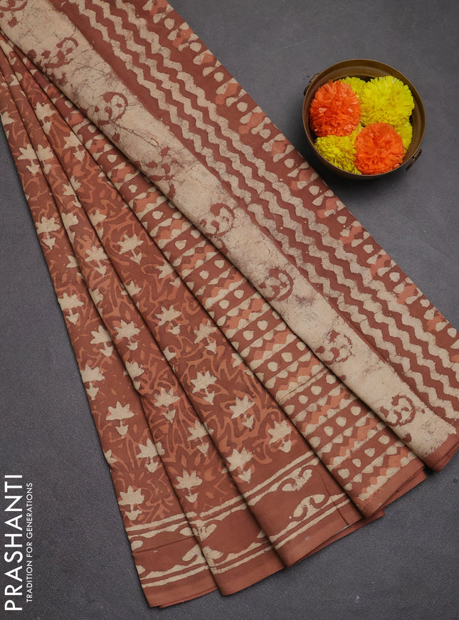 Jaipur cotton saree dark peach with allover dabu prints and printed border