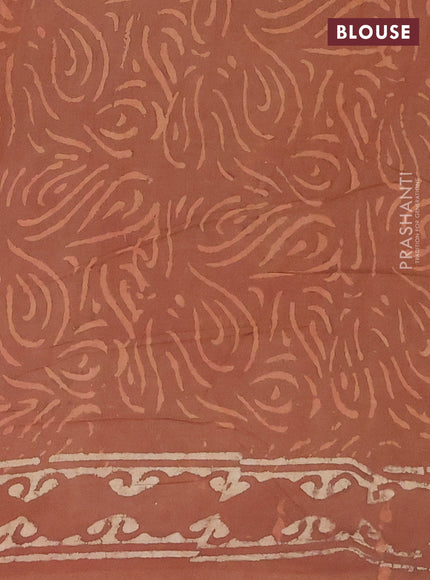 Jaipur cotton saree dark peach with allover dabu prints and printed border