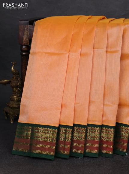 Silk cotton saree pale orange and bottle green with plain body and zari woven korvai border