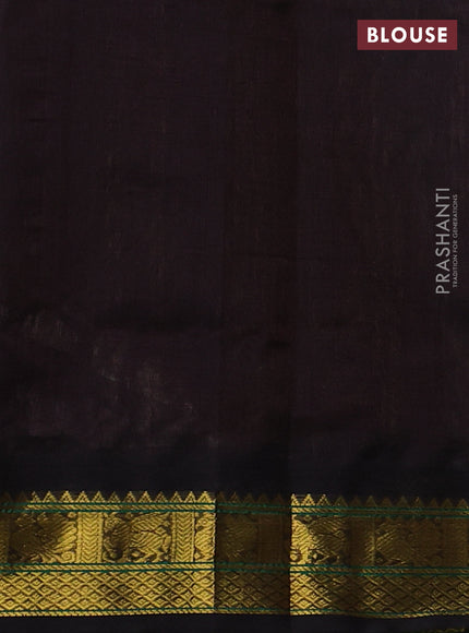 Silk cotton saree pastel green and black with plain body and zari woven korvai border