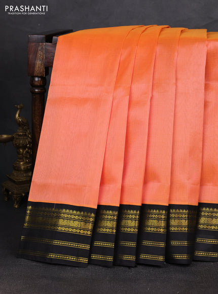 Silk cotton saree peach orange and black with plain body and zari woven korvai border