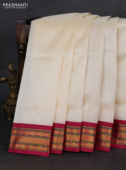 Silk cotton saree off white and wine shade with plain body and zari woven korvai border