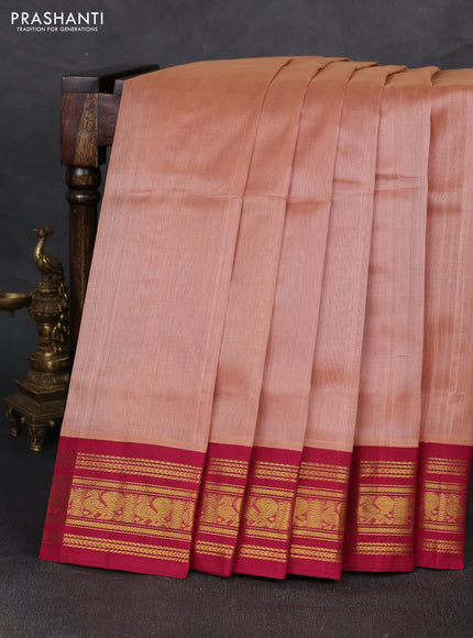 Silk cotton saree dark peach and wine shade with plain body and zari woven korvai border
