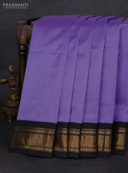 Silk cotton saree lavender and black with plain body and zari woven korvai border