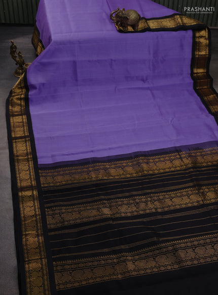 Silk cotton saree lavender and black with plain body and zari woven korvai border