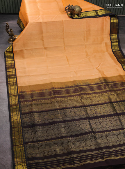 Silk cotton saree peach orange and black with plain body and zari woven korvai border