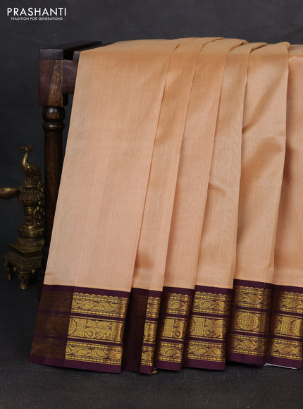 Silk cotton saree sandal and deep wine with plain body and zari woven korvai border