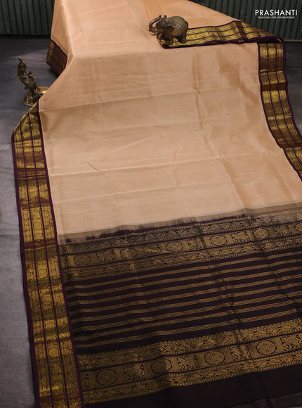 Silk cotton saree sandal and deep wine with plain body and zari woven korvai border