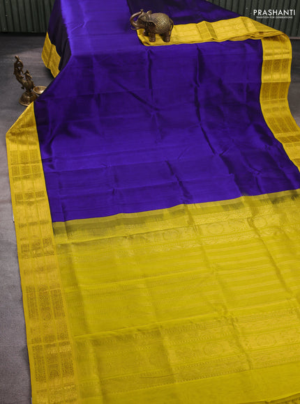 Silk cotton saree violet and lime yellow with plain body and zari woven korvai border