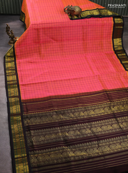 Silk cotton saree dual shade of pinkish orange and black with allover checked pattern and zari woven korvai border
