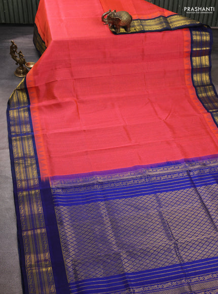 Silk cotton saree dual shade of pinkish orange and blue with allover small zari checked pattern and zari woven korvai border