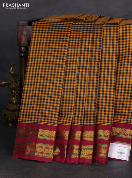 Silk cotton saree mustard yellow and wine shade with allover paalum pazhamum checked pattern and zari woven korvai border
