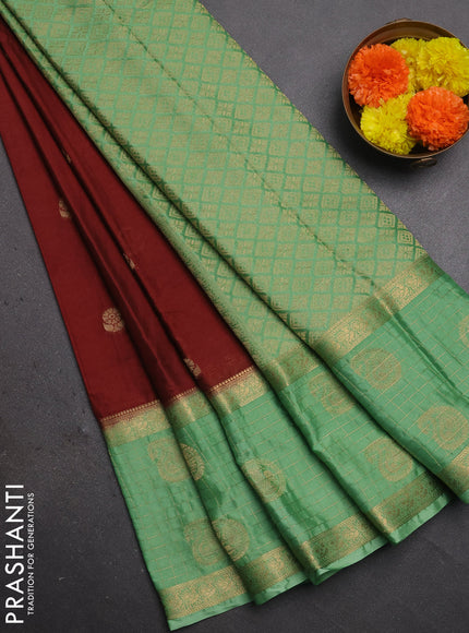 Semi mysore silk saree brown and pastel green with zari woven buttas and long zari woven butta border
