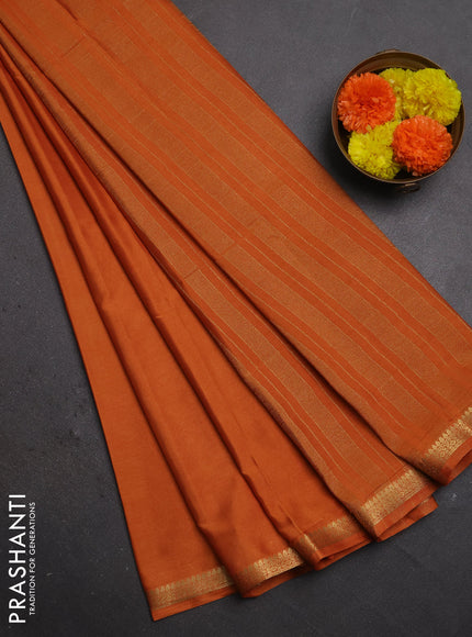 Semi mysore silk saree rust shade with plain body and small zari woven border