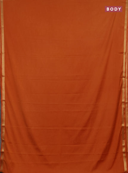 Semi mysore silk saree rust shade with plain body and small zari woven border