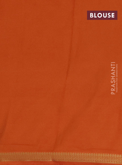 Semi mysore silk saree rust shade with plain body and small zari woven border