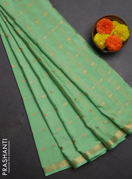 Semi mysore silk saree mild teal green with allover zari woven buttas and small zari woven border