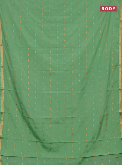 Semi mysore silk saree mild teal green with allover zari woven buttas and small zari woven border