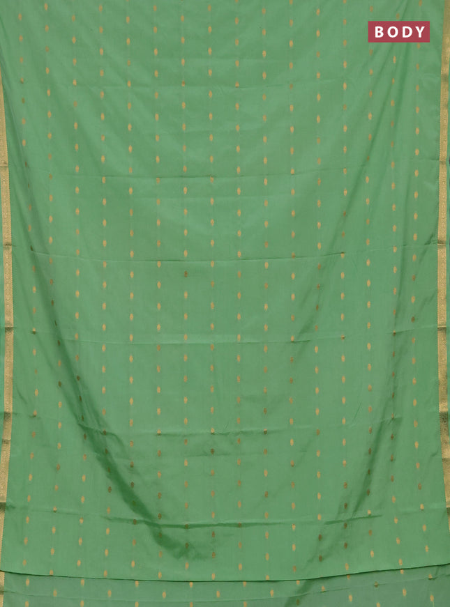 Semi mysore silk saree mild teal green with allover zari woven buttas and small zari woven border