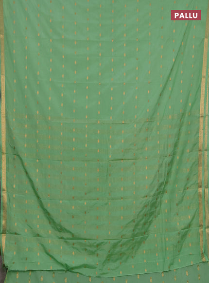 Semi mysore silk saree mild teal green with allover zari woven buttas and small zari woven border