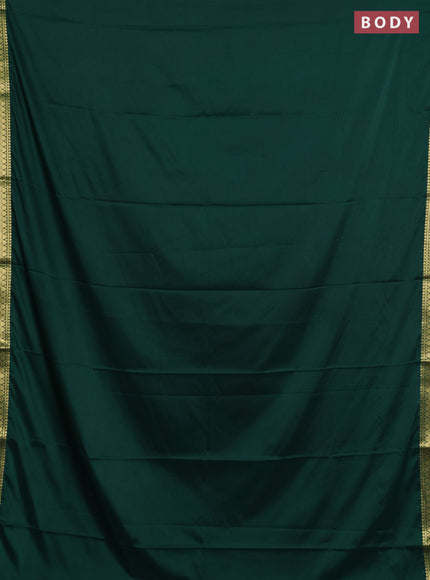 Semi mysore silk saree green with plain body and small zari woven border