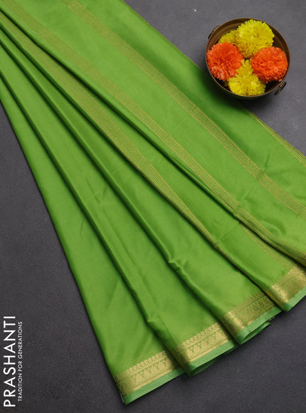 Semi mysore silk saree light green with plain body and small zari woven border