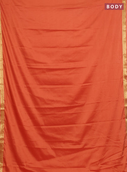 Semi mysore silk saree rustic orange with plain body and small zari woven border