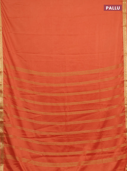 Semi mysore silk saree rustic orange with plain body and small zari woven border